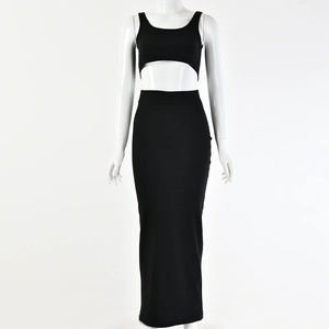 Detailed view of women's black two-piece knit set with sleeveless crop top and high waist maxi skirt