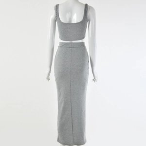 Rear view of grey ribbed two-piece set featuring a cropped tank top and long skirt