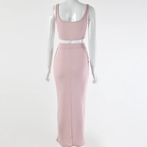 Rear view of pink ribbed two-piece set featuring a sleeveless crop top and maxi skirt