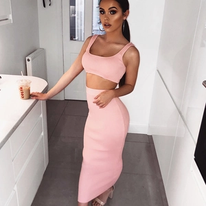 Detailed view of pink ribbed knit two-piece set featuring crop top and high waist maxi skirt