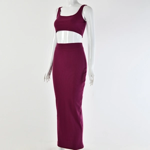 Detail of wine red ribbed knit two-piece set featuring sleeveless crop top and maxi skirt
