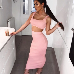 Detail of pink knitted two-piece set featuring crop top and high-waisted midi skirt