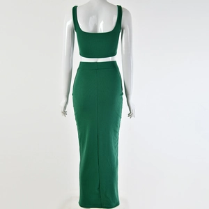 Rear view of women's green ribbed knit two-piece set featuring cropped top and maxi skirt