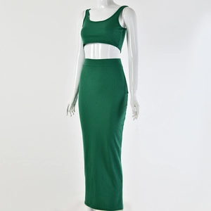 Detail view of a green ribbed knit two-piece set featuring cropped tank top and maxi skirt