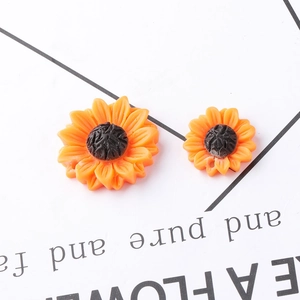 Sunflower resin charms with orange petals and dark centers for DIY necklace jewelry making