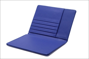 Detail view of the blue leather passport holder showing multiple card slots and interior storage