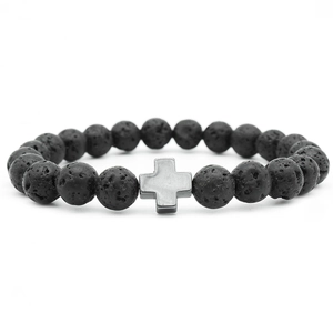 Black volcanic stone beaded bracelet with silver-gray cross charm on white background