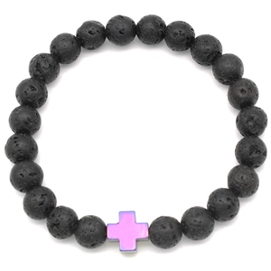Macro detail of natural black lava stone beads and iridescent purple cross charm bracelet