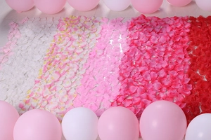 Detailed view of artificial rose petals arranged in a gradient for wedding decoration