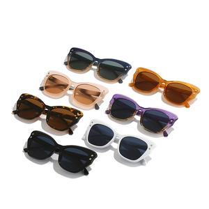 Collection of seven trendy cat-eye sunglasses with colorful frames and metal rivet accents