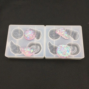 Silicone resin molds for seashell and snail shapes with iridescent glitter pendants