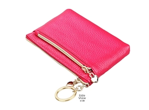 Detailed side view of fuchsia leather coin purse with heart zipper and gold keychain