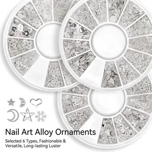 Silver metal nail art studs set with stars and moons in three 12-grid organizer boxes