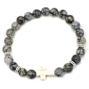 Detailed close-up of grey cracked agate beads bracelet with a white cross charm
