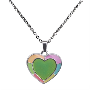 Detail of silver heart necklace with color-changing green center and rainbow enamel edges