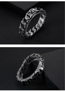 Macro view of stainless steel punk skull bracelet with fish scale texture detail