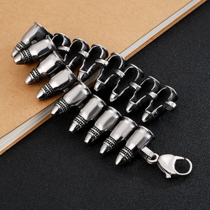 Men's gothic punk style bullet link bracelet in silver stainless steel on dark background