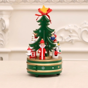 Rotating green wooden Christmas tree music box with festive ornaments and golden star