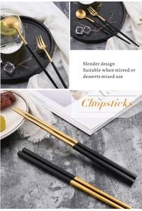 Macro view of slender black and gold 304 stainless steel cutlery set on marble surface