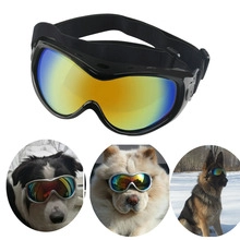 Detail of UV-protective dog goggles with reflective lenses and adjustable elastic head strap