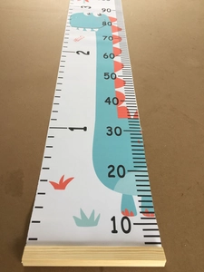 Canvas growth chart for kids featuring a cute cartoon dinosaur and wooden hanging rod