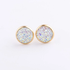 Macro view of 10mm golden stainless steel stud earrings with white druzy crystal inlay