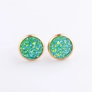 Close-up of 10mm green mineral druzy studs with gold plated stainless steel frames