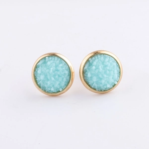 Detail of 10mm gold plated stainless steel studs with light blue mineral druzy crystals