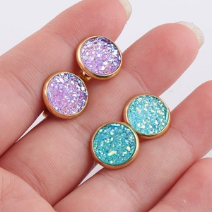 Handheld shot of 10mm sparkling druzy earrings in purple and blue stainless steel