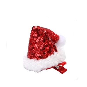 Sparkly red sequin Christmas hat hair clip with white plush trim on white background