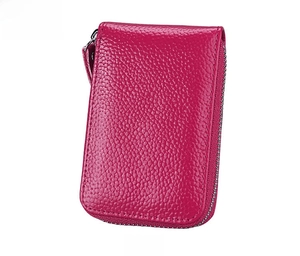 Detailed front view of rose red pebble leather card holder with secure side zipper
