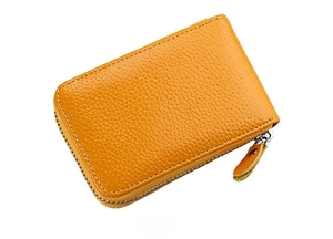Side view of yellow pebbled leather credit card wallet with U-shaped metal zipper closure