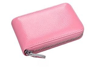 Side view of pink genuine leather card holder featuring pebble texture and silver zipper