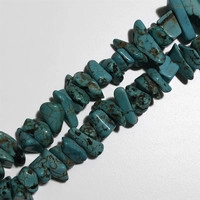 Macro shot of natural turquoise stone spacer beads with unique black veins for DIY jewelry
