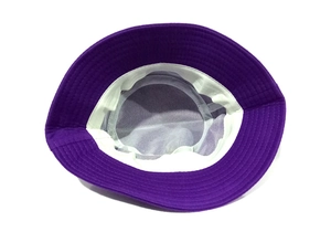 Detail view of cotton bucket hat interior showing white sweatband and mesh lining