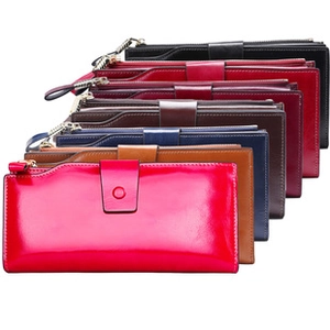 Stacked collection of men's long wallets in multi-color leather with RFID protection