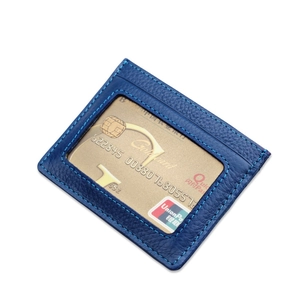Minimalist blue leather RFID blocking card holder with visible stitching on white background