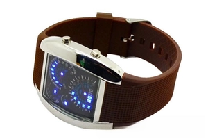 Detail view of silver metal case and brown silicone strap on aviation LED watch