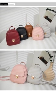 Detailed close-up of mini PU leather backpacks with metal buckles in multiple colors