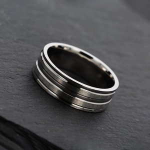 Detailed macro view of 8mm stainless steel ring with brushed finish and double grooves