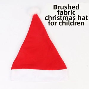Detail view of red brushed fabric Christmas hat for children with white pom-pom