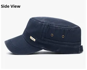 Side view of washed cotton cadet cap with metal eyelets and a vintage silver logo plate