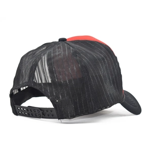 Detailed back view of red trucker hat featuring black breathable mesh and snapback closure