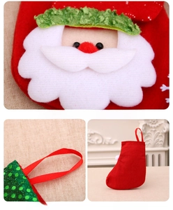 Detail of Christmas stocking featuring sequined Santa Claus patch and green glitter trim