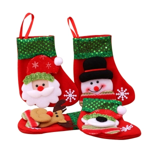 Set of four festive sequined Christmas stockings featuring Santa, Snowman, Reindeer and Bear