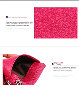 Detail of rose red cowhide leather coin purse with litchi grain and metal zipper