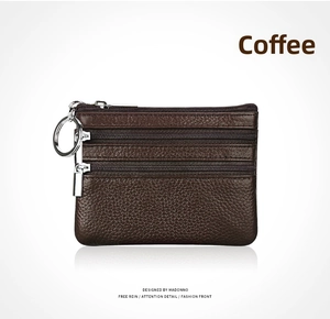 Detail of coffee brown pebble leather coin purse with three zipper pockets and key ring