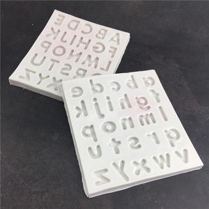 Silicone alphabet molds for fondant with uppercase and lowercase letters in white