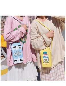 Detail view of 750ml pure milk and banana milk carton crossbody bags in PU leather