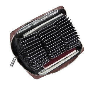 Deep brown pebble grain leather wallet showing 36 card slots and RFID passport pocket